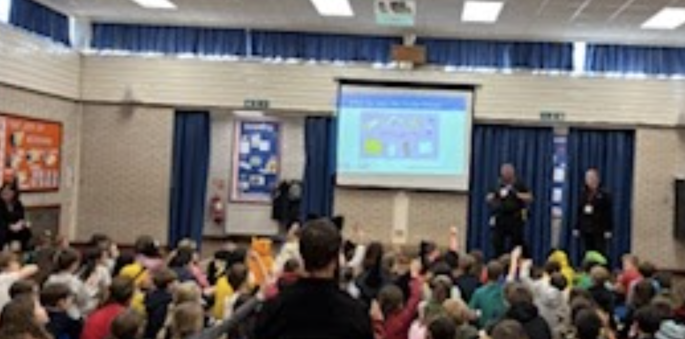 Students watching a presentation in a hall